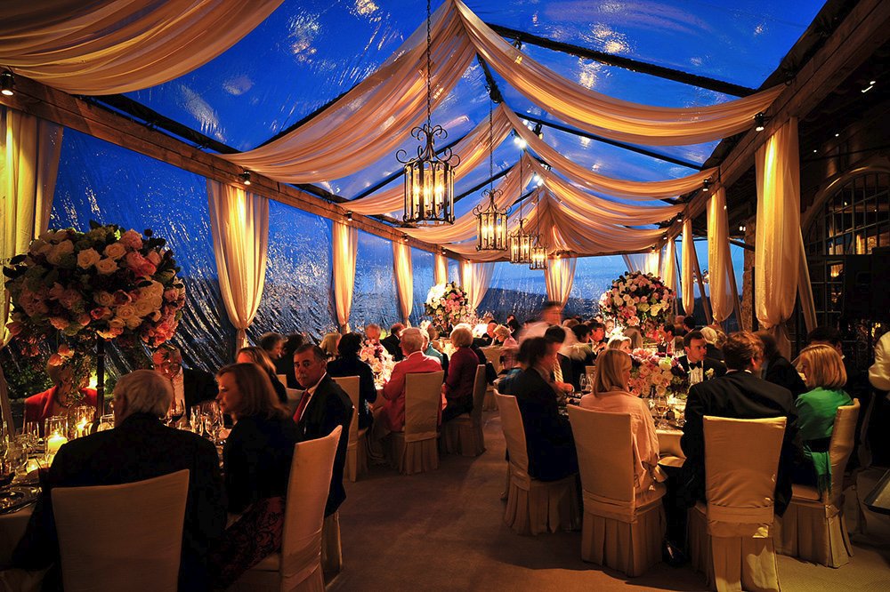 Gorgeous Carmel Valley wedding tent with uplighted drapes