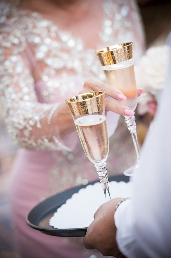 Mother of bride toasting with gold wedding champagne flutes