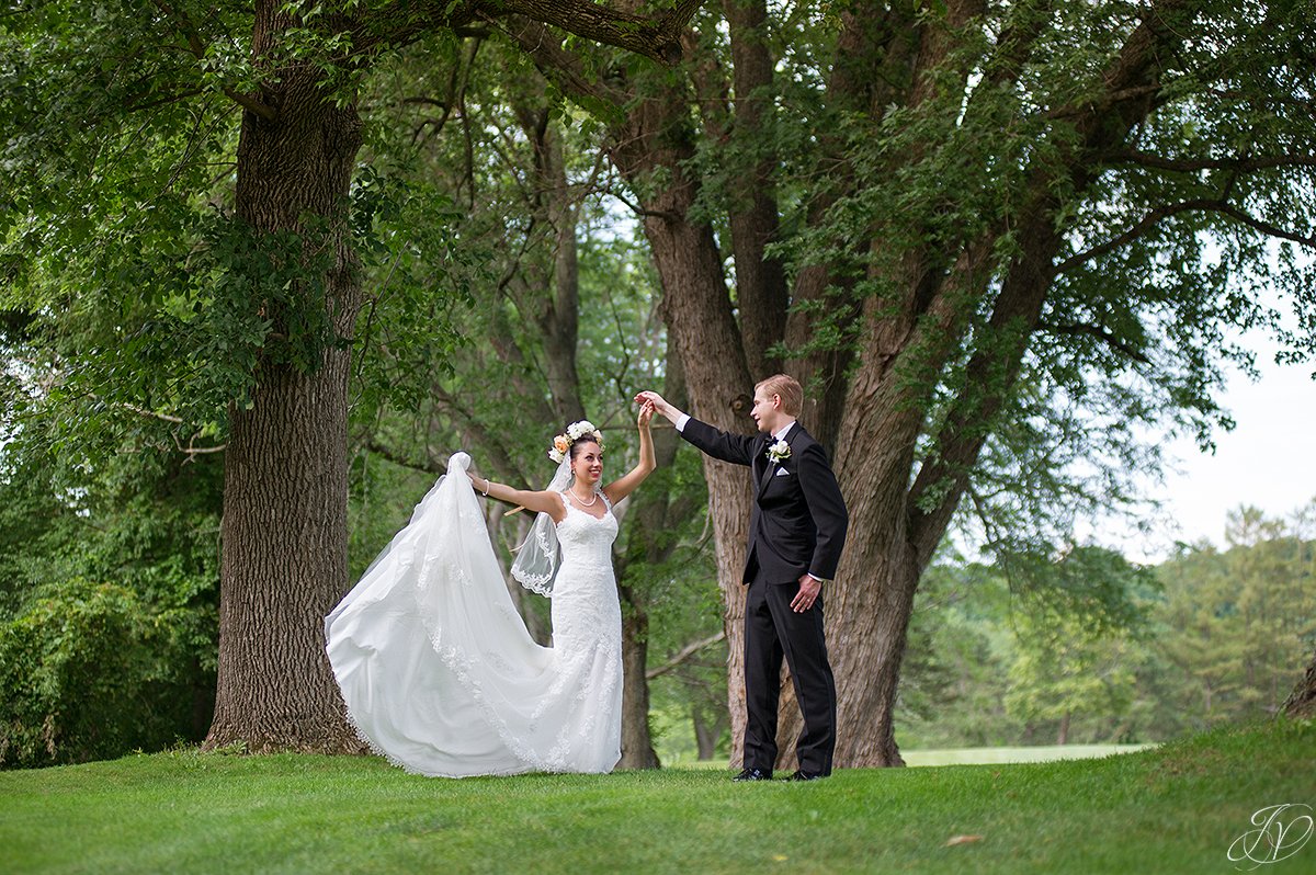 bride and groom dancing outside normanside country club