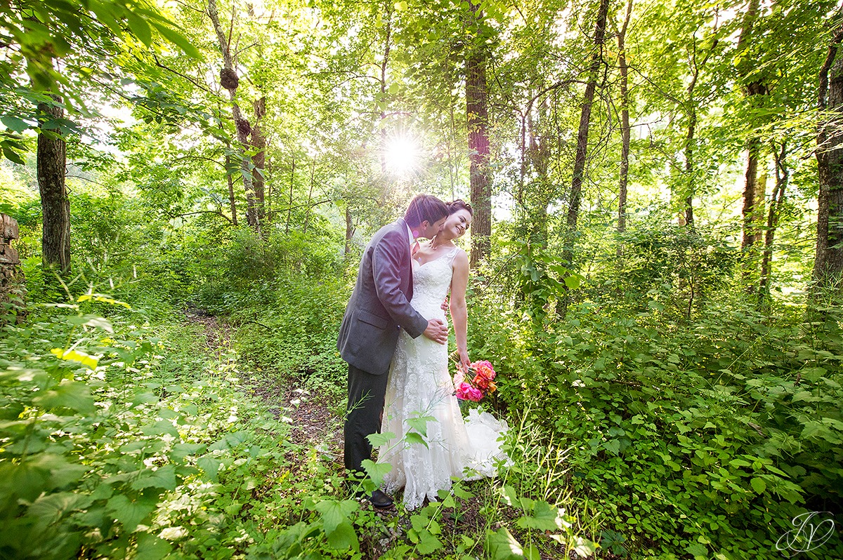 romantic shot of bride and groom, sun flare photo