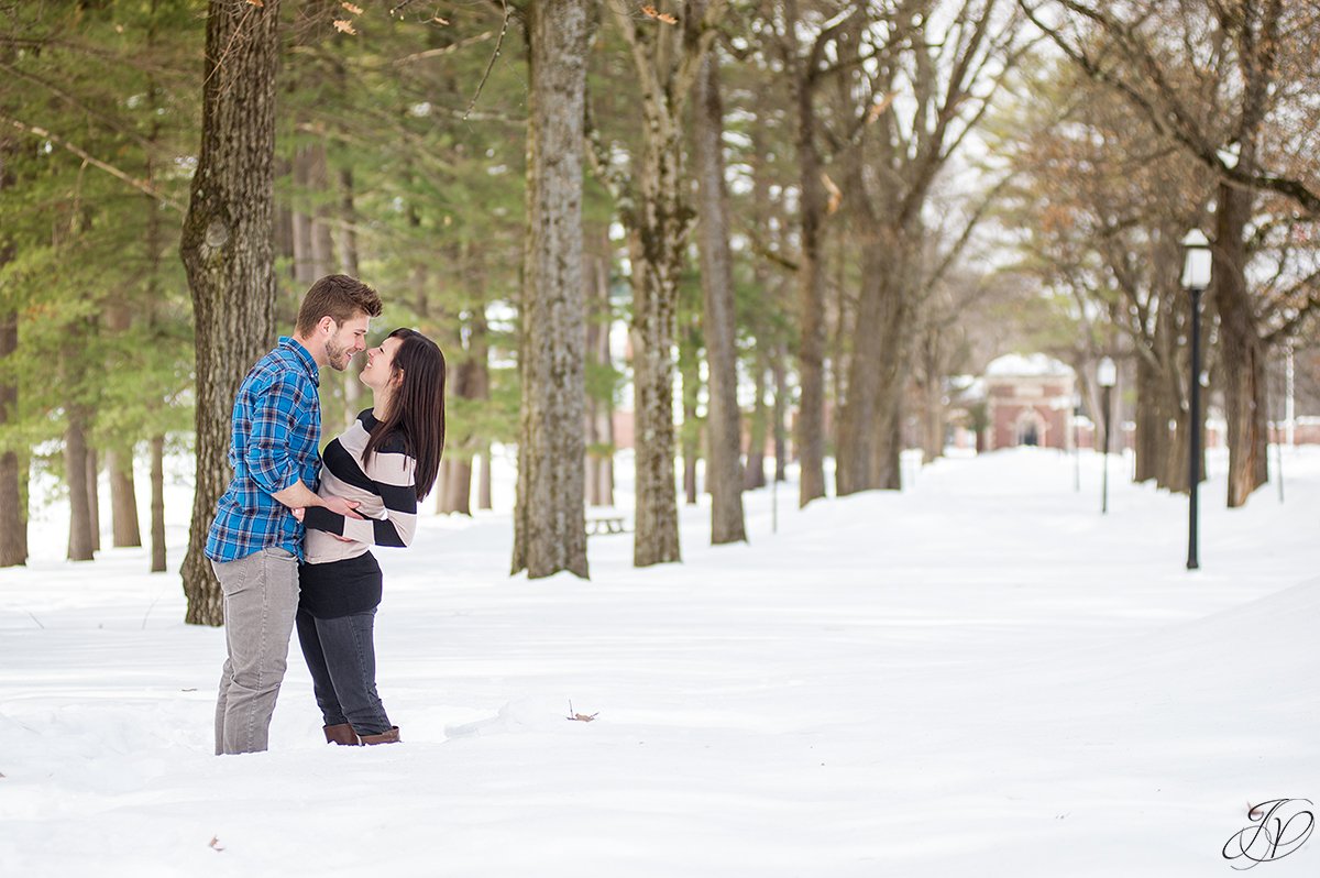 photo of engaged couple in the snow