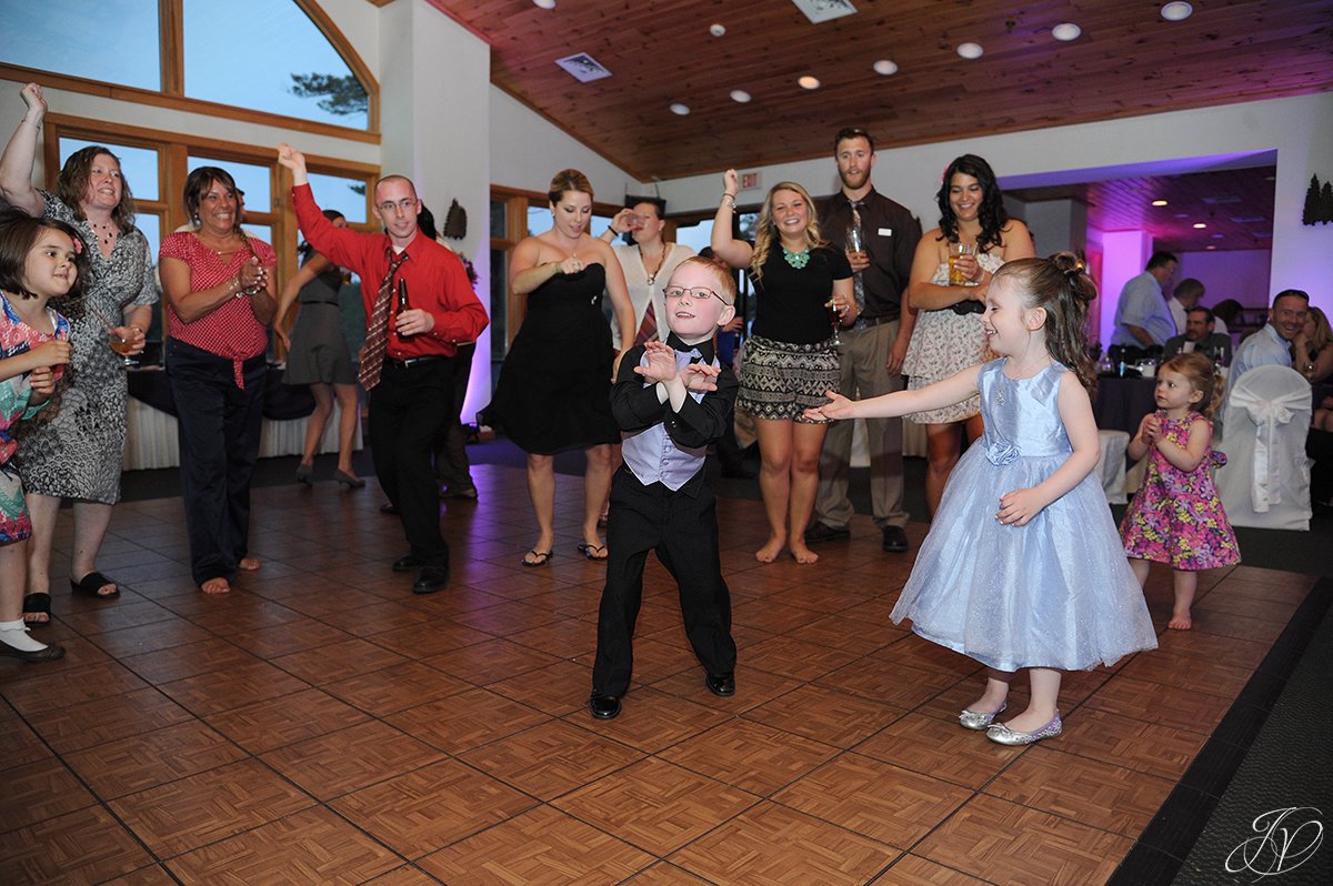 cute photo of kids dancing at wedding reception