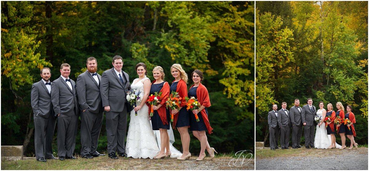 intimate bridal party in dark blue fall waterfron