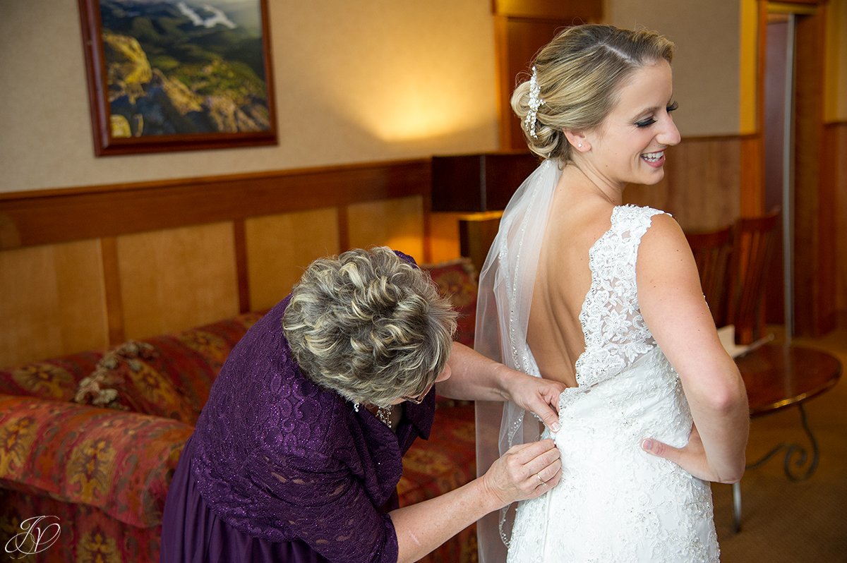 bride getting ready with mom