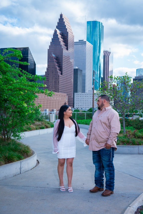 Couple holding hands in a city park
