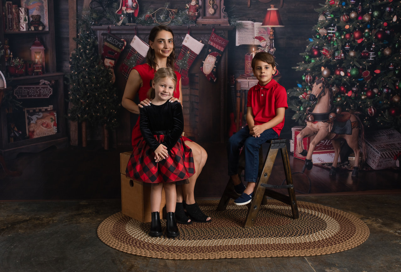 Charleston, SC - Christmas Portrait of a family on a Christmas background - Heather Johnson Photography