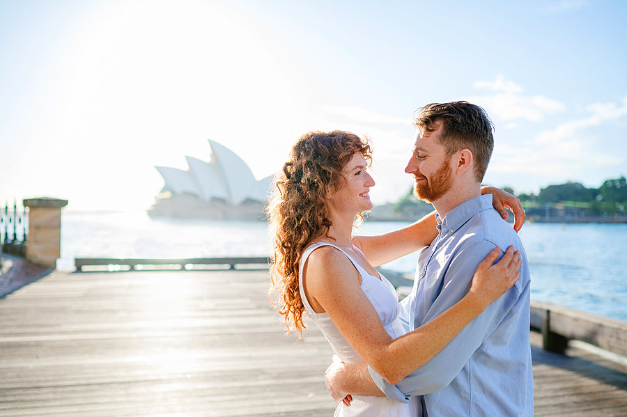 Portrait of a couple embracing with the backdrop of the Sydney Opera House