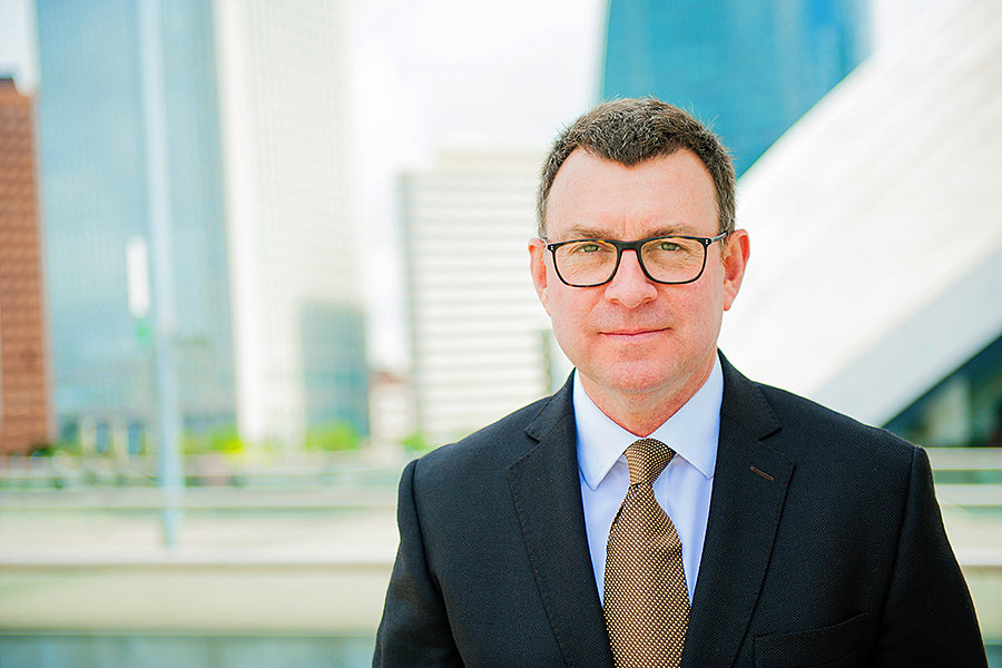 Headshot portrait of a male business man at La Defense in Paris