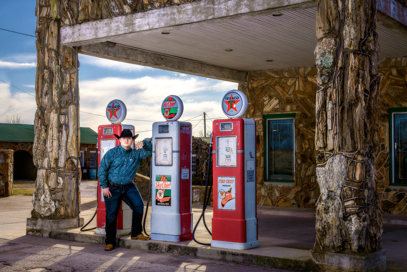 High school senior cowboy guy antique gas station pump Decatur Texas