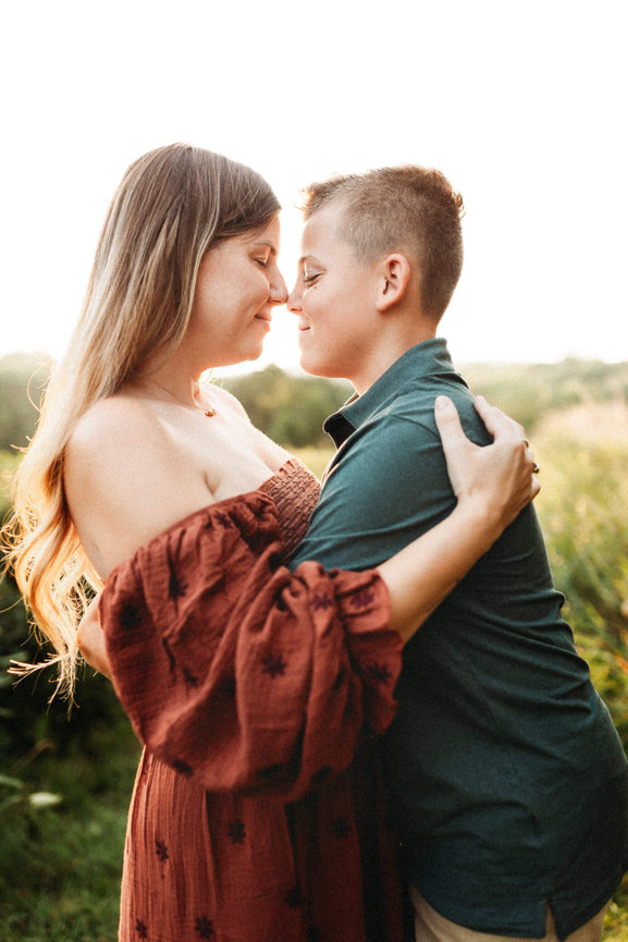 A mother and her teenage son touching noses during their family photo session in Morris County, New Jersey.