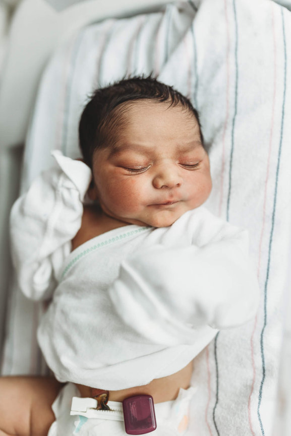 A newborn baby sleeping in a hospital bassinet during Morristown Medical Center Fresh 48.