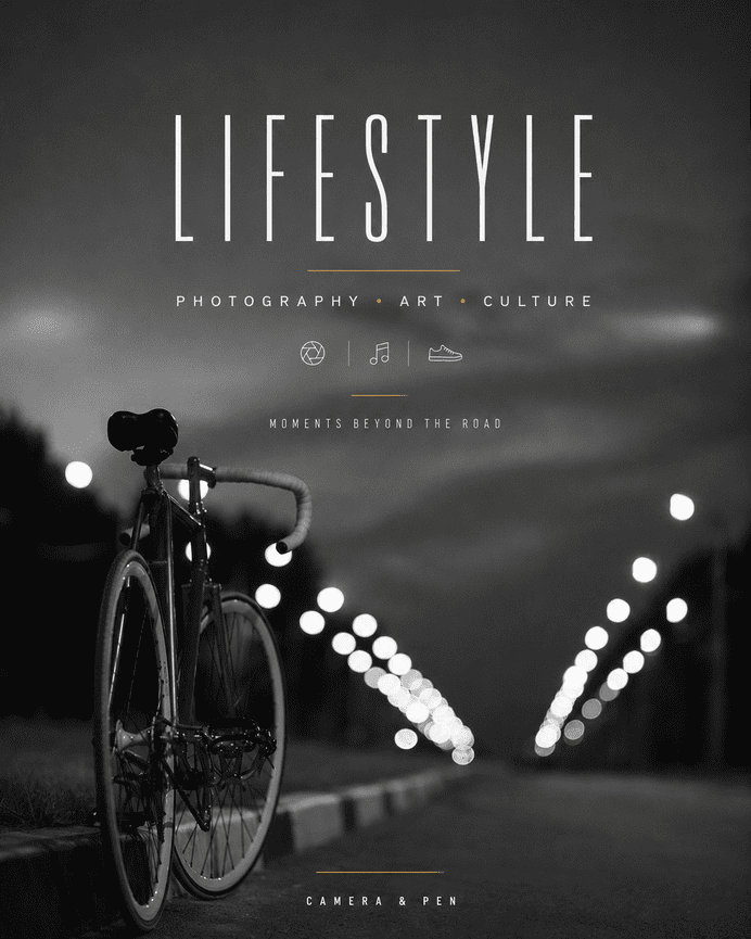 Black and white photo of a bicycle parked on a street at night with blurred city lights in the background