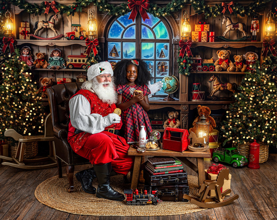 Santa Claus enjoying a Christmas cookie with a child in a festive Santa’s Workshop during a Christmas mini session for Akron area families