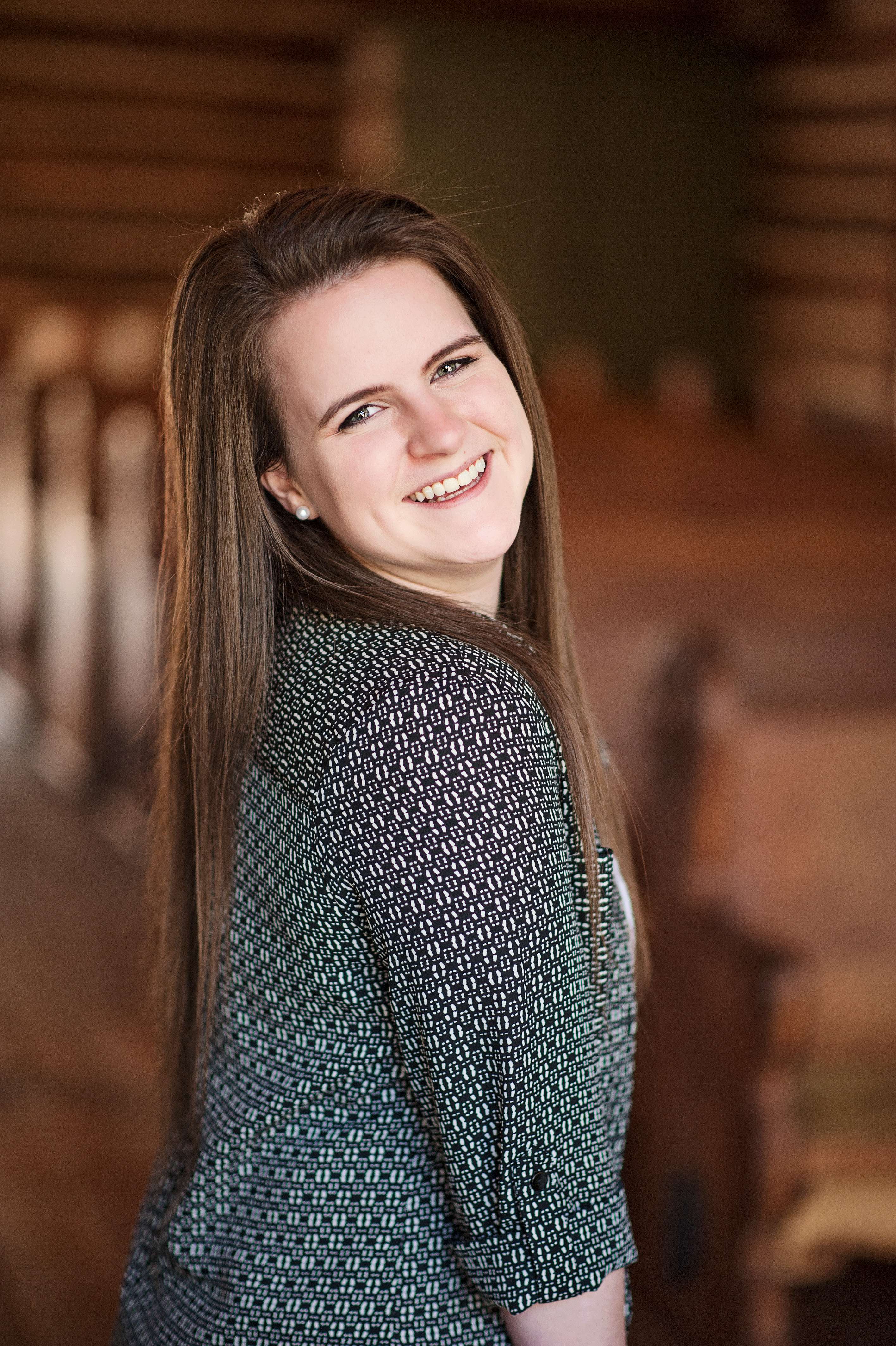 senior girl laughing inside Hope Wilderness Chapel at Dogwood Canyon Branson Missouri