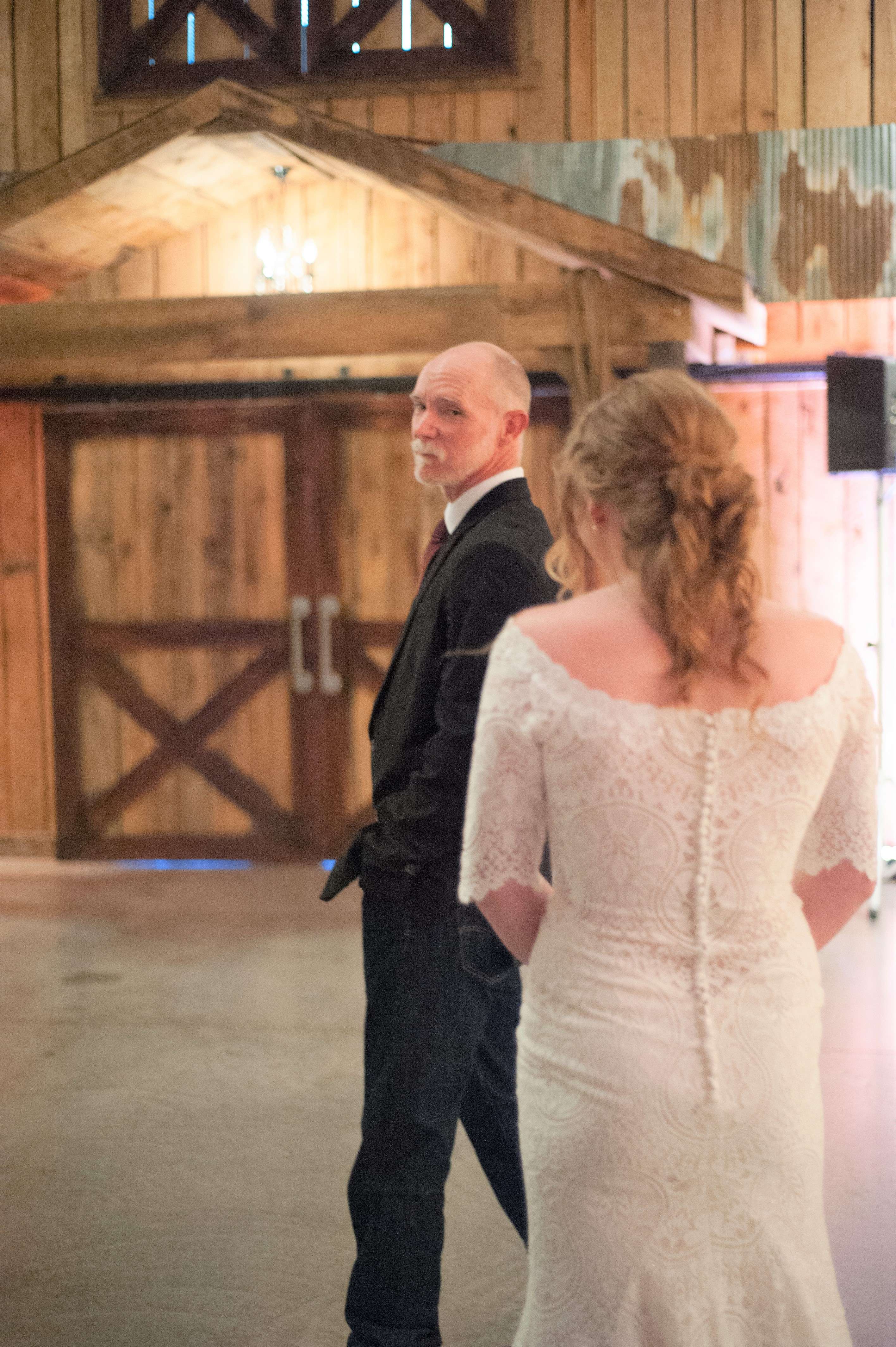 Father at first look to see his daughter in her wedding dress.