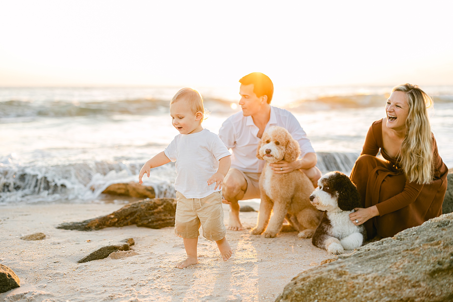 family on the beach at sunrise in St. Augustine Florida