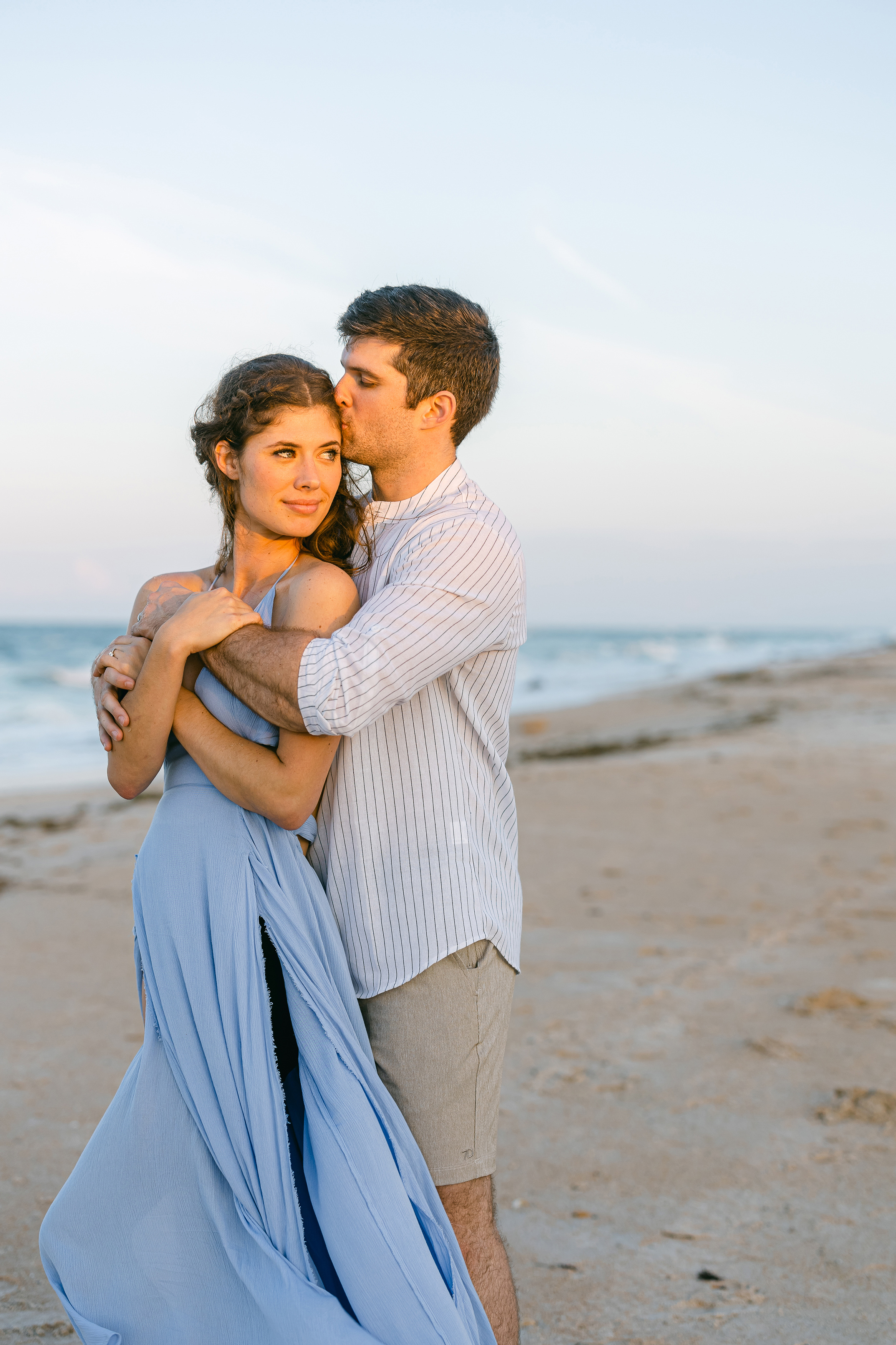 sunset portrait of man and woman holding each on Saint Augustine Beach