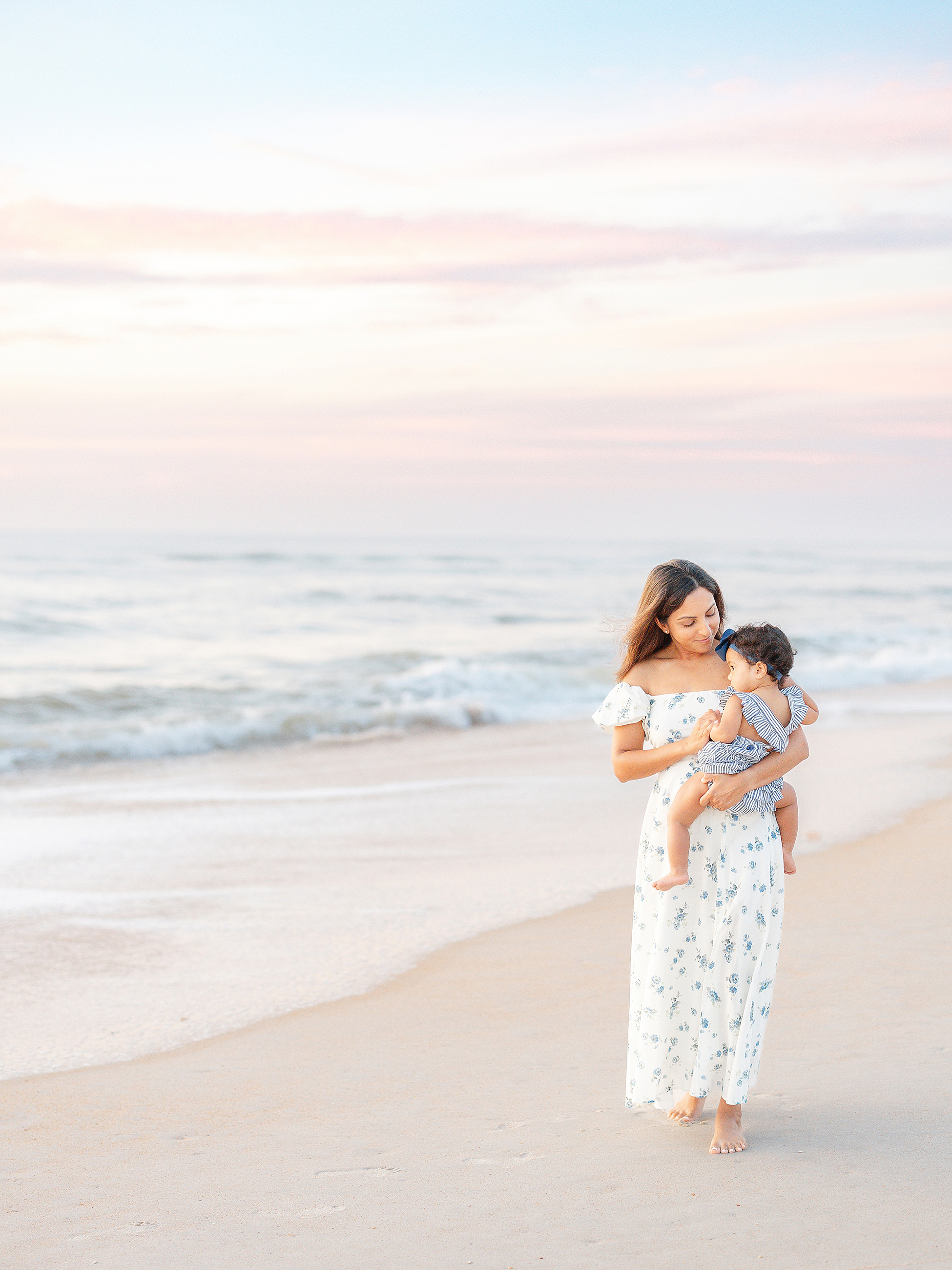 a pastel sunrise beach portrait of mother and daughter in St. Augustine