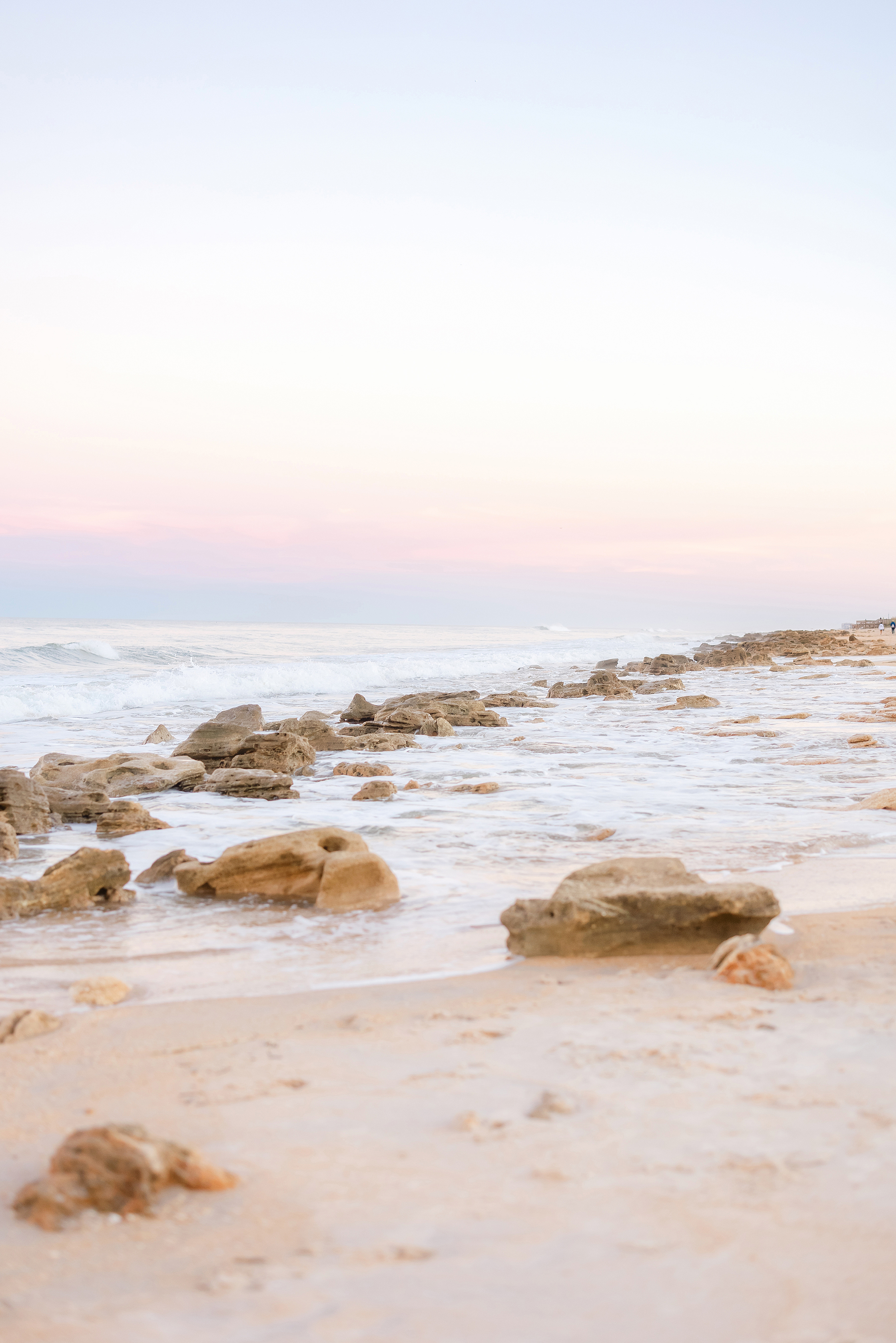 A pastel sunset beach portrait in St. Augustine, Florida.