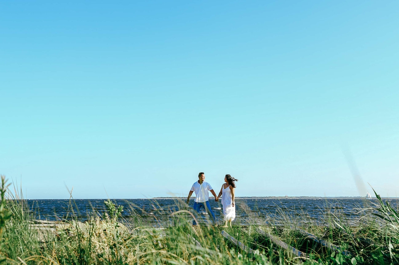 Heirloom-quality portraiture on a secluded South Shore cove, where the natural pink coral sand meets the jagged limestone formations of the Atlantic coast.