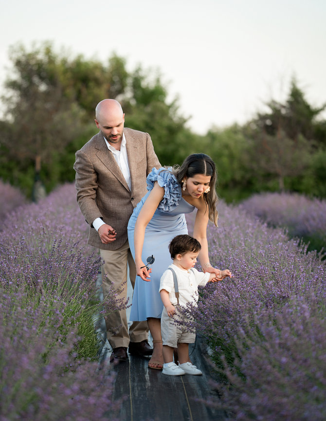 Family enjoying a natural light portrait session in a lavender field in Iowa City
