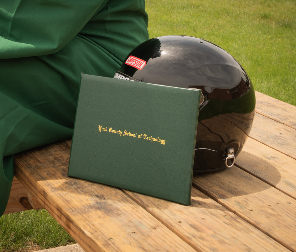 Graduation cap and diploma on a table