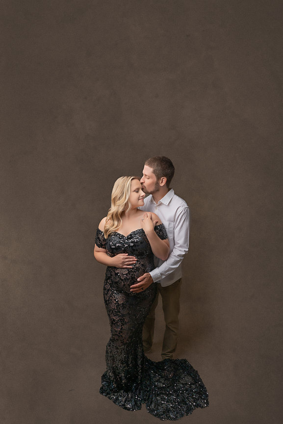 Timeless pregnancy photo of couple expecting their first baby, captured in luxury studio near Sea Girt NJ.
