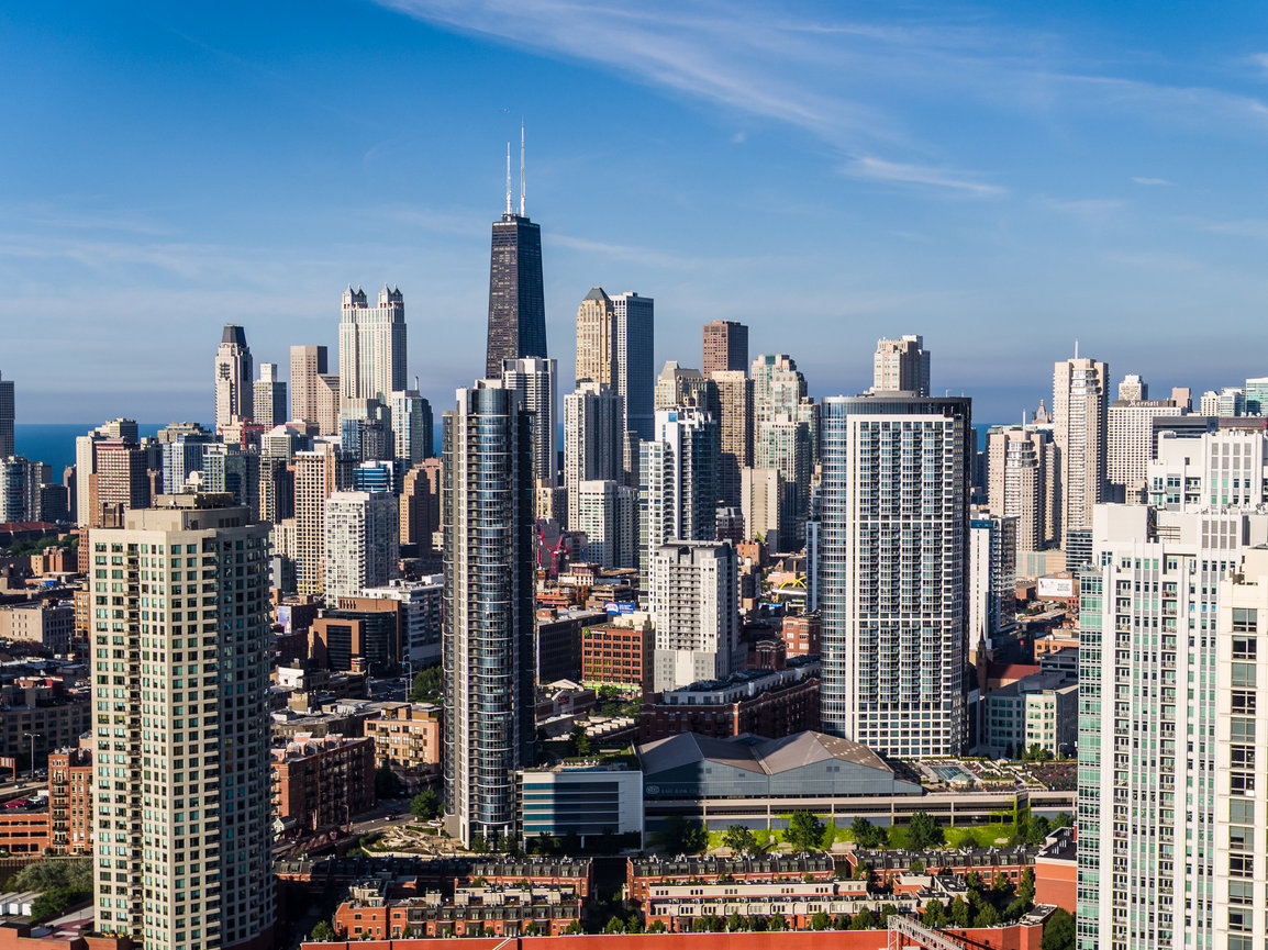 City skyline with skyscrapers under blue sky