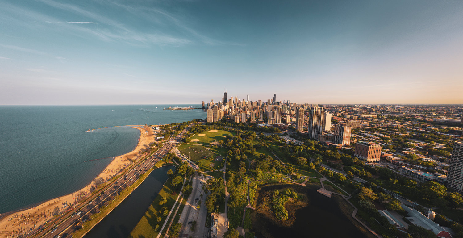 City skyline along the shoreline at sunset