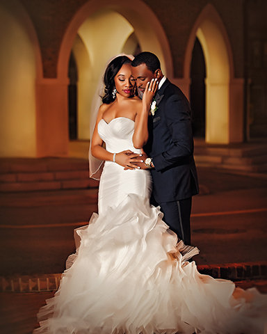 Wedding Couple posing at night in front of the Fayetteville, NC Market House