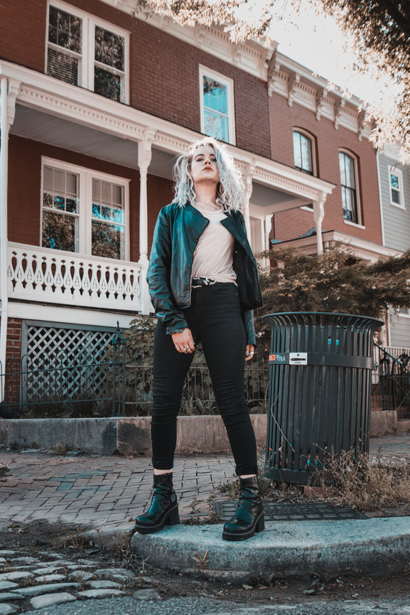 Woman in stylish outfit posing on a city street