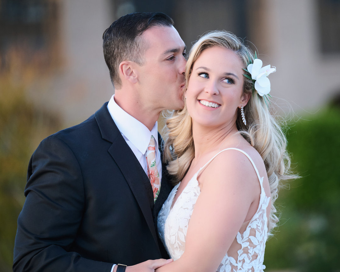Bride and Groom couple smiling and posing close together