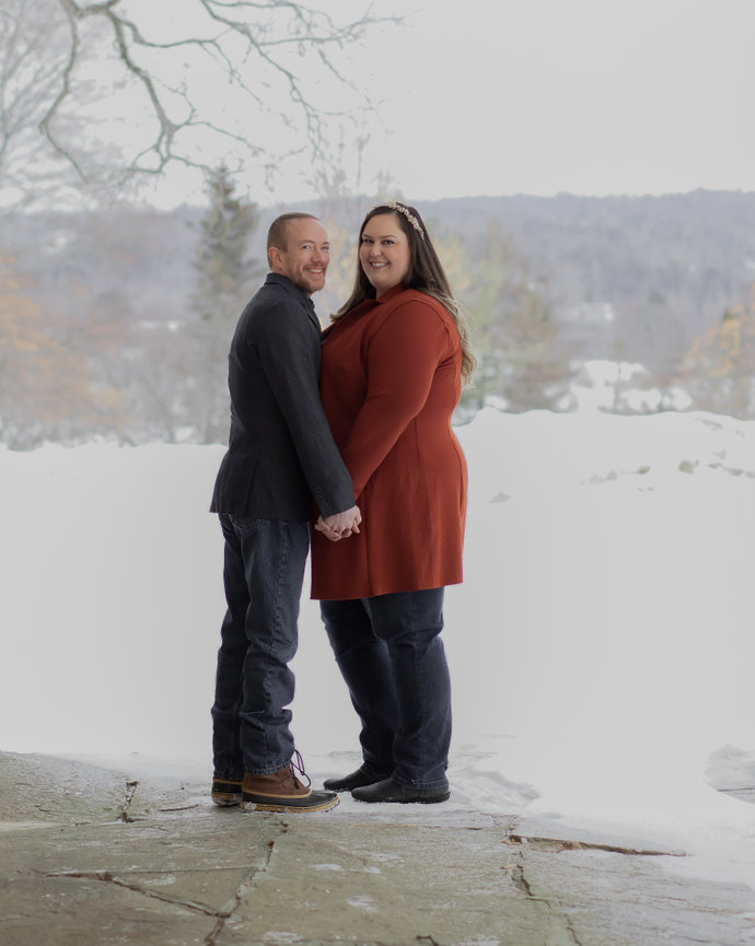 Couple holding hands in a snowy landscape