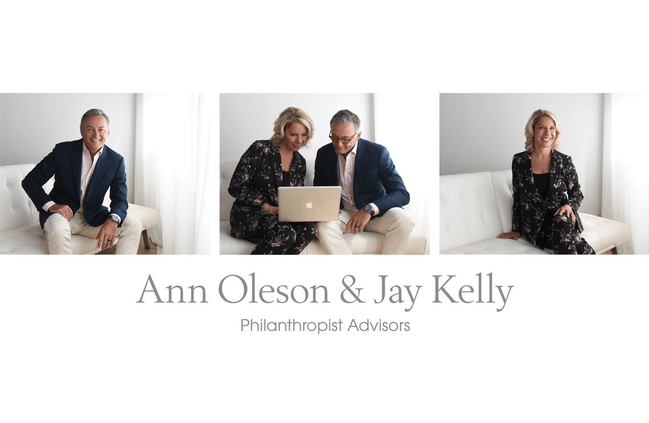 Business branding images of Ann and Jay looking at their laptop in the Kliks Photography studio.