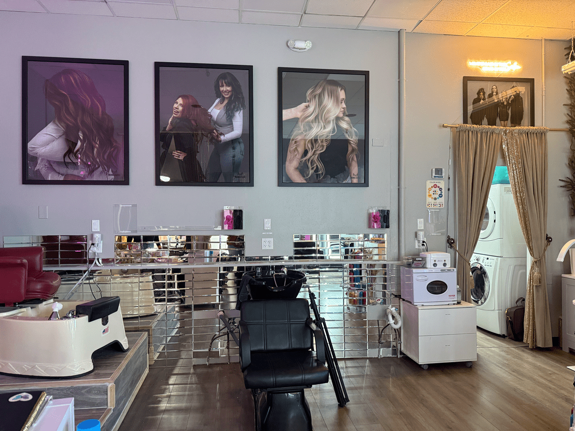 Photography studio interior with framed portraits, lights, and equipment