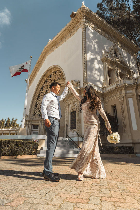 Couple dancing outside a historic building