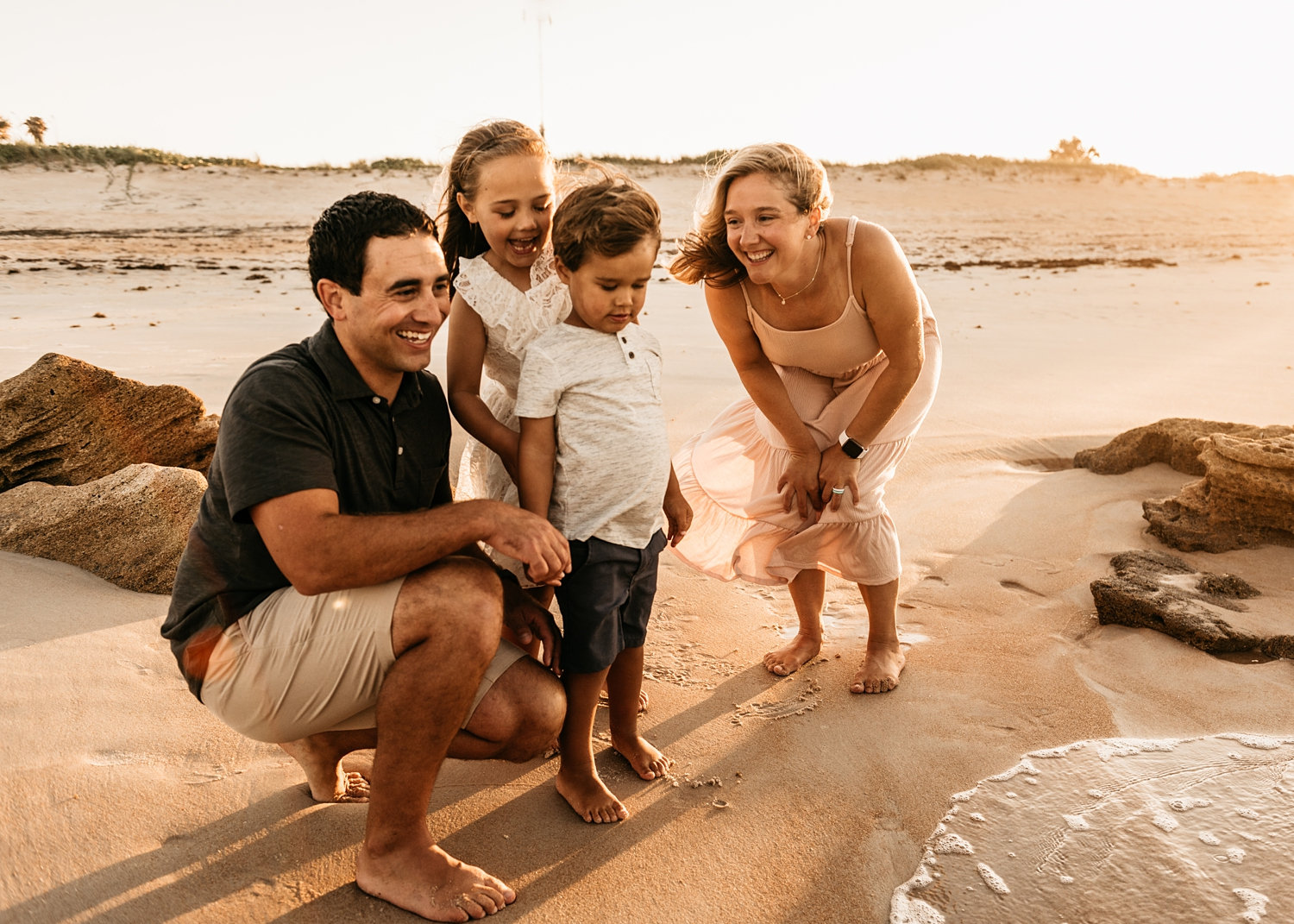 family of four on St. Augustine Beach in Florida, family fun on the beach, Rya Duncklee